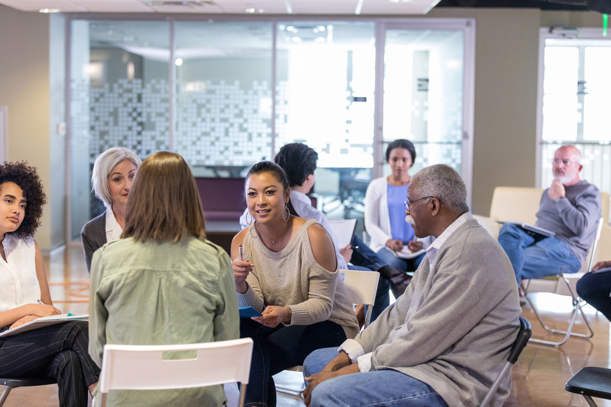 Employees brainstorm ideas during weekly meeting