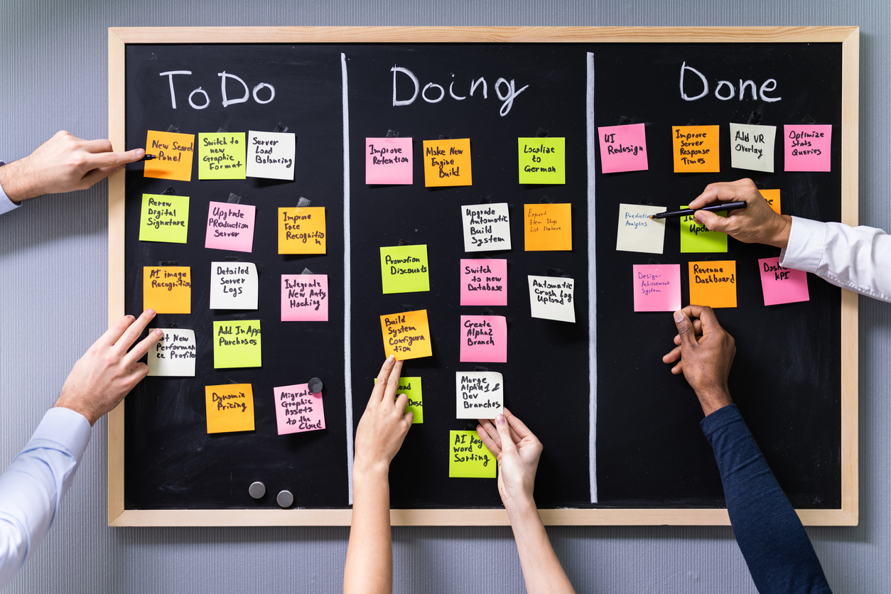 Group Of People Writing On Sticky Notes